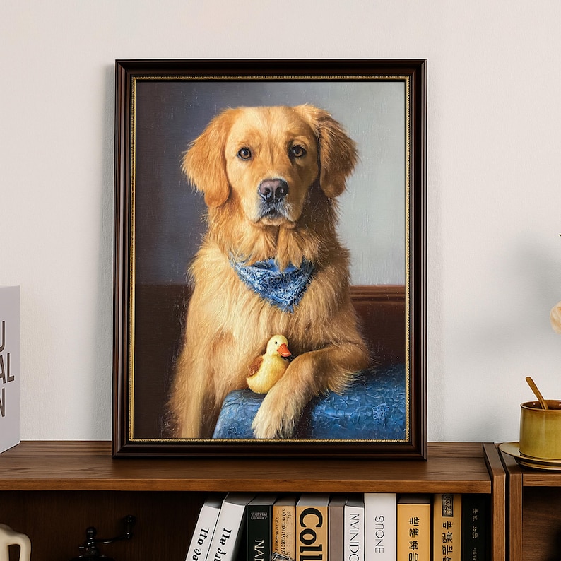May include: A framed portrait of a Golden Retriever dog wearing a blue bandana and holding a yellow rubber duck. The dog is depicted sitting on a blue cushion. The frame is dark brown.