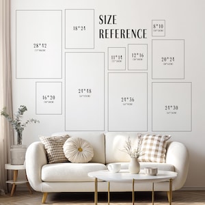 May include: A wall displaying framed art prints in various sizes, such as 71x106cm, 46x61cm, and 41x51cm. The text "SIZE REFERENCE" is above the prints. A white sofa and coffee table are in the foreground, creating a home decor scene.
