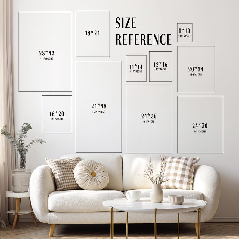 May include: A wall displaying framed art prints in various sizes, such as 71x106cm, 46x61cm, and 41x51cm. The text "SIZE REFERENCE" is above the prints. A white sofa and coffee table are in the foreground, creating a home decor scene.