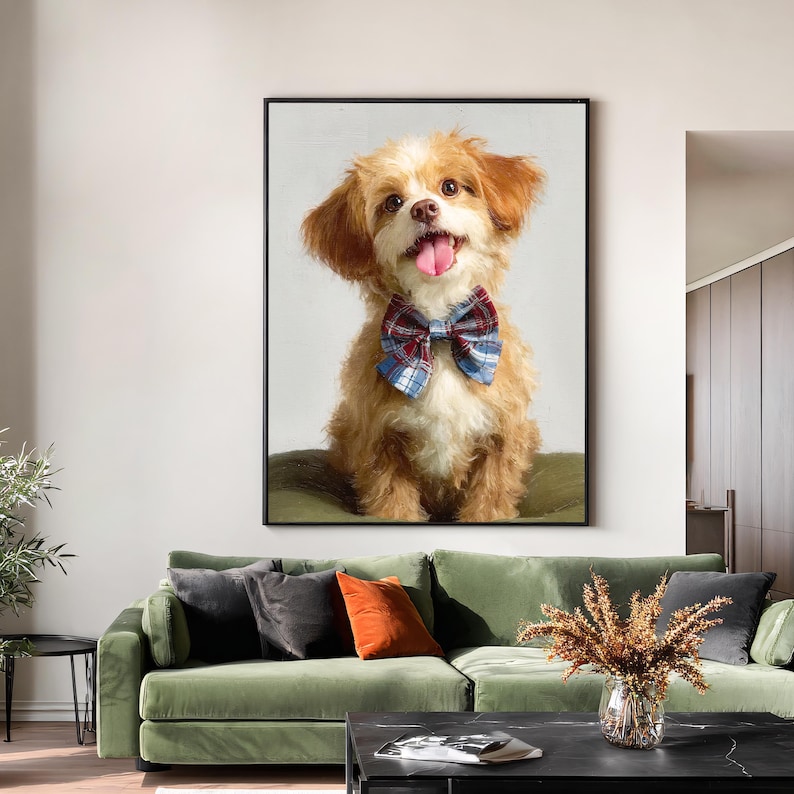 May include: A framed painting of a smiling, fluffy dog with brown and white fur. The dog wears a blue, red, and white plaid bow tie. The dog's tongue is visible. The painting is displayed above a green sofa.