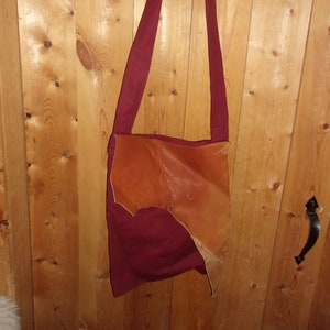 burgundy haversack with leather flap