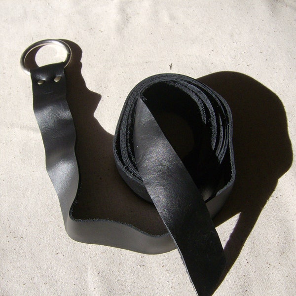 Black leather ring belt made of top grade leather of a supple weight for a nice tie.  72 - 90 inches long