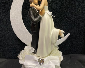 Magic Romantic Moment Moonlight Wedding Cake Topper groom  Top  ornament First Kiss.   Blonde bride , brown hair groom facial hair mustache