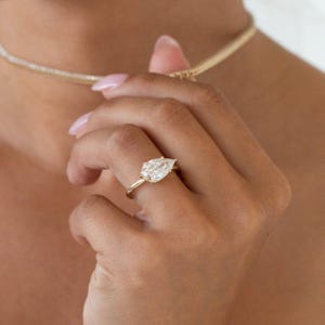 East-West Pear Cut Moissanite Engagement Gold Ring, Elegant Solitaire Engagement Ring, timeless statement piece for women, Pear Cut Ring.