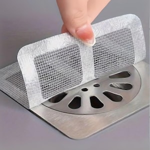 Paquete de 5 tapas adhesivas para desagües: atrapapelos de acero inoxidable para cocina, baño, fregadero o ducha. Fáciles de limpiar y desechables.