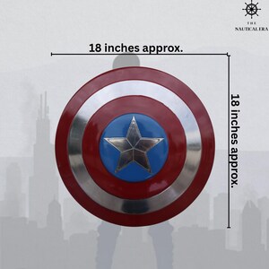 May include: A round shield, approximately 18 inches in diameter, with a red outer ring, a silver middle ring, and a blue center featuring a silver five-pointed star. The shield is a replica of a superhero's shield.
