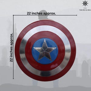 May include: A round shield, approximately 22 inches in diameter, with a red, silver, and blue color scheme. The shield features a silver star in the center, set against a blue circle, and is surrounded by red and silver bands. The Nautical Era logo is in the upper right corner.
