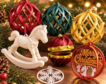 May include: A collection of Christmas ornaments including a white rocking horse, a red lattice sphere, a green lattice sphere, a yellow lattice sphere, a red and gold striped sphere, a white snowflake disc, and a red ring with Merry Christmas text.