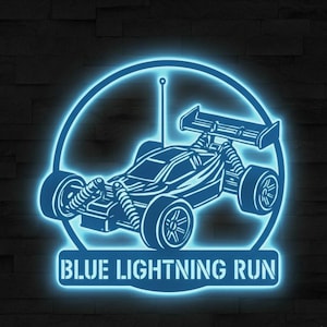 May include: A blue neon sign featuring a detailed outline of a remote-controlled car within a circular frame. The text "BLUE LIGHTNING RUN" is displayed below the car. The sign is illuminated against a dark, textured background.
