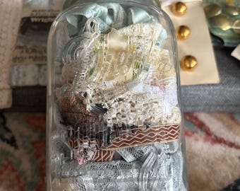 Drey Square Mason Jar w lid full of vintage lace trim and misc sewing notions