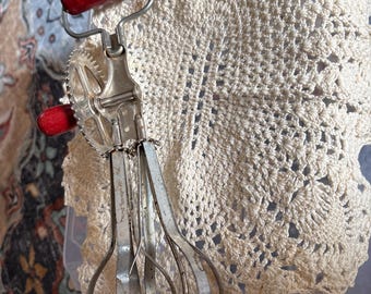 vintage Ekco eggbeater with a red wooden handle
