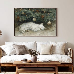 May include: A framed painting depicts a white cat sleeping under a Christmas tree adorned with gold and red ornaments. The artwork has a vintage aesthetic, with soft colors and a cozy atmosphere, suitable for home decor.
