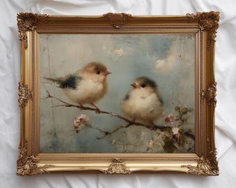 May include: An antique-style framed painting featuring two small birds perched on a branch with delicate pink blossoms. The birds have soft, fluffy feathers in shades of brown, white, and blue. The ornate gold frame adds a touch of elegance.