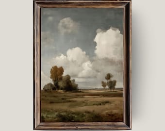 May include: A framed landscape painting depicts a field under a cloudy sky. The artwork features a brown wooden frame. The painting's color palette includes shades of brown, green, and white, creating a serene and naturalistic scene.