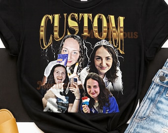 May include: Black t-shirt with a gold "CUSTOM" graphic. The graphic features four images of a person holding various items, including a snack, a phone, a cat, and a popsicle. The shirt is paired with denim shorts and sandals.