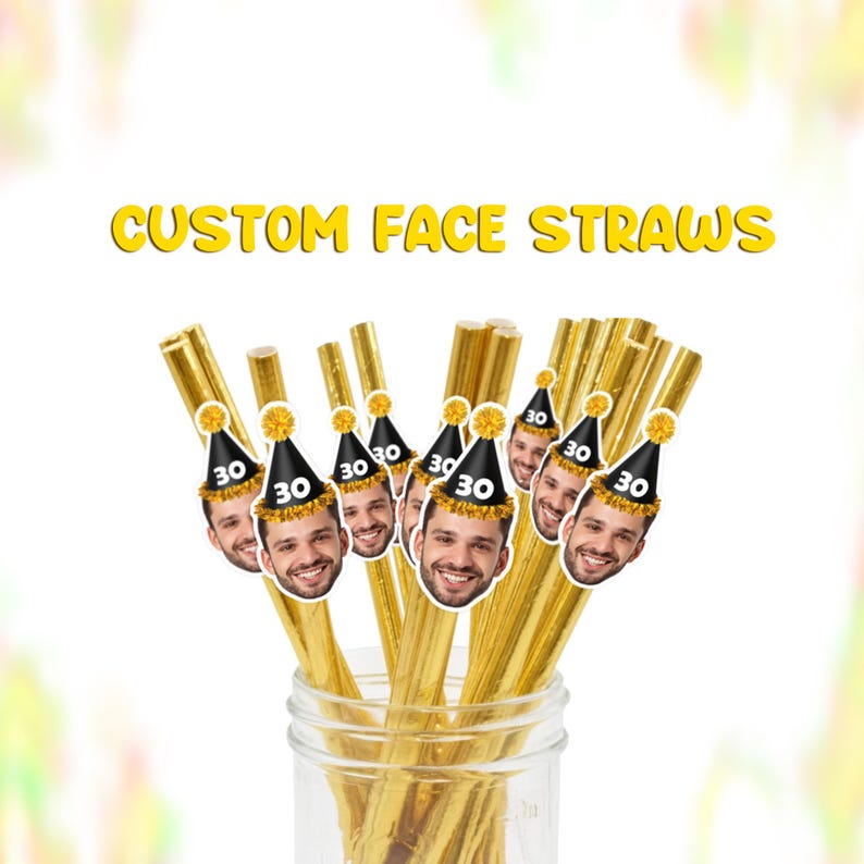 May include: A collection of gold-colored straws with custom face cutouts attached, each wearing a black party hat with the number 30. The text "CUSTOM FACE STRAWS" is displayed in yellow.