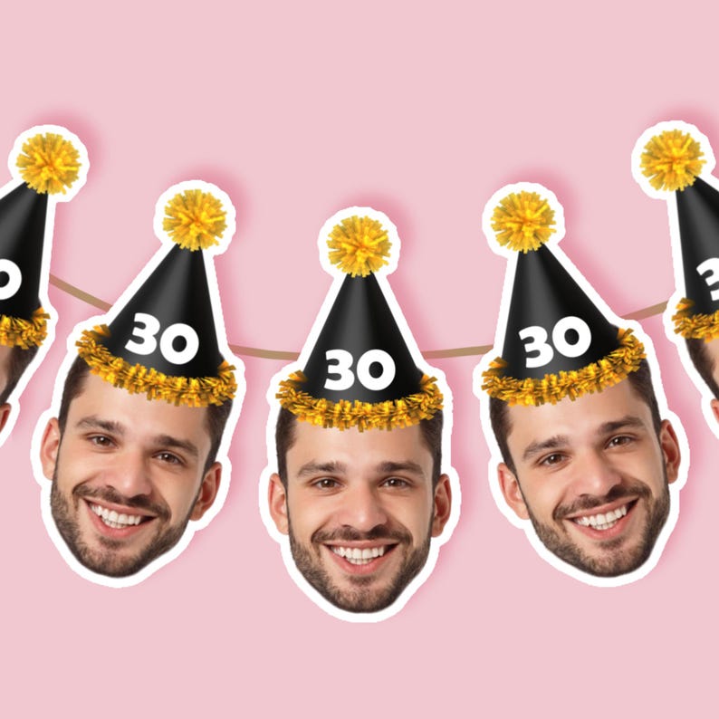 May include: A string of party decorations featuring smiling faces wearing black party hats with gold trim and yellow pom-poms. Each hat displays the number "30" in white. The background is a light pink color.