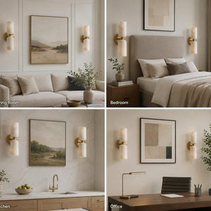 May include: A wall-mounted light fixture featuring two cylindrical, translucent white stone shades stacked vertically on a circular brass base. The design includes a central brass connector between the shades, providing a warm, diffused glow.