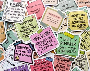 May include: A collection of colorful reminder stickers with various motivational quotes and affirmations. The stickers are in different shapes and sizes, with handwritten fonts and decorative elements.