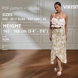 May include: A woman wearing a white ruffled top and a wrap skirt with a green and white floral pattern. The skirt is paired with white sandals. The text on the image says "VIKISEWS" and "PDF pattern + tutorial". The height is 5'4" - 5'6".