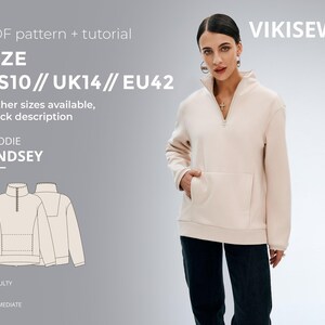 Puede incluir: Una mujer con una sudadera con capucha beige claro con un bolsillo delantero y una cremallera. La imagen es un anuncio de un patrón PDF y un tutorial para la sudadera con capucha "Lindsey", talla EU42. Dificultad intermedia.