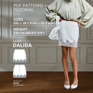 May include: A white mini skirt featuring a scalloped hemline with white lace trim. The text on the image reads: PDF PATTERNS + TUTORIAL, SIZES US2 – 20 // EU34 – 52 // UK6 – 24, HEIGHT 170-176 CM (5'7"-5'9"), SKIRT DALIDA, DIFFICULTY INTERMEDIATE.