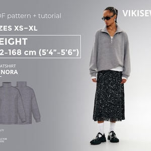 May include: A gray sweatshirt with a half-zip collar, paired with a black sequined skirt. The image includes text indicating it's a PDF pattern and tutorial for sizes XS-XL, with a height range of 5'4"-5'6". The sweatshirt is the "ANNORA" style.