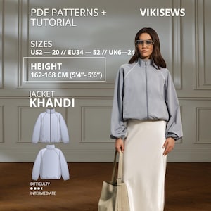 May include: A light blue zip-up jacket with long sleeves and a high collar, paired with a long cream skirt. The image includes text: PDF PATTERNS + TUTORIAL, VIKISEWS, SIZES US2-20, EU34-52, UK6-24, HEIGHT 162-168 CM (5'4"-5'6"), JACKET KHANDI.