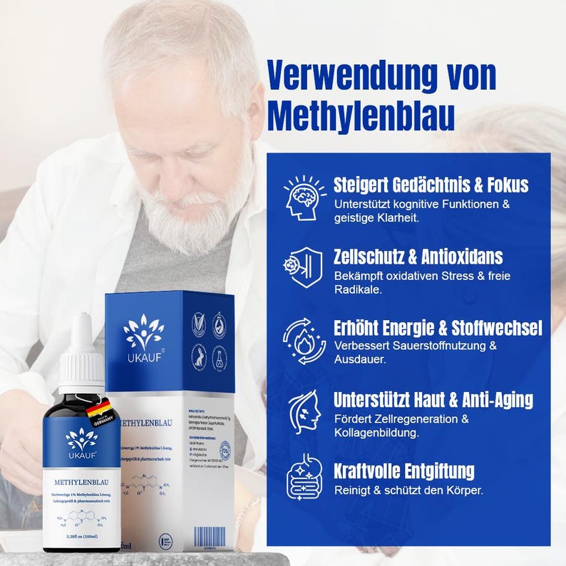May include: A blue and white box and a small bottle of UKAUF Methylene Blue. The bottle has a dropper and a German flag sticker. The box has the UKAUF logo and text in German describing the product's benefits, including focus, antioxidants, and anti-aging.