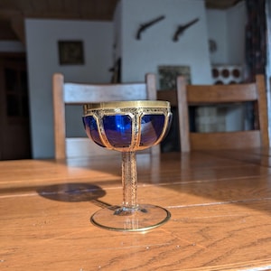 Cobalt vintage champagne glass with gold cabochon pattern in Moser Bohemia style from early 20th century for elegant table decor