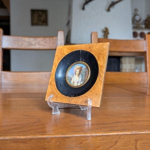 Antique French hand-painted portrait miniature in a black and brown wooden frame for vintage home decor