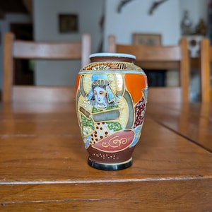 Satsuma style Japanese vintage porcelain vase with hand painted ornate figures and gold details made in Japan