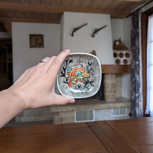 Small ceramic dish with colorful fish design for fisherman gift or rustic cabin wall decor
