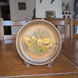 Vintage hand painted wooden plate with motif of two little chickens from Switzerland for rustic home decor as a housewarming gift