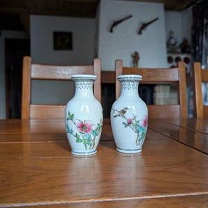 Pair of vintage porcelain Chinese vases from the 70s with red branding “Zhong Guo Jing de Zhen Zhi” hand painted bird on a flowering tree