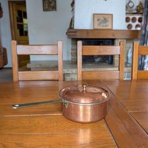 Spring Swiss vintage copper pot with long handle and lid from Switzerland