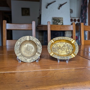 Brass vintage ashtray in round or oval shape with a choice of embossed ship and fish or people scene as a smoker&#39;s gift