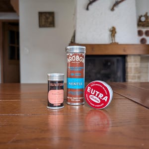 Vintage set of 3 old Swiss tin containers from Nestlé and pharmacy brands for collectors of retro packaging and medical tins