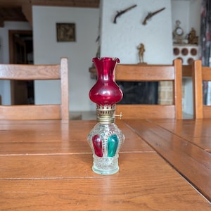 Vintage glass oil lamp with red and green drip pattern and ruby red chimney, retro home decor made in Hong Kong