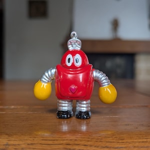 Encendedor vintage Ganbare Robocon con un robot rojo de Japón