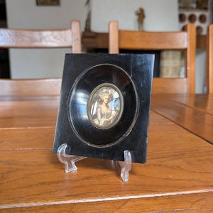 Vintage miniature portrait of Queen Marie Antoinette of France with a rose in a round black wooden frame as a gift for antique home decor