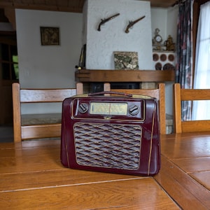 WeltFunk Swiss 50s vintage bakelite tube radio suitcase with world wave tuning and leather handle for retro decor or collector display