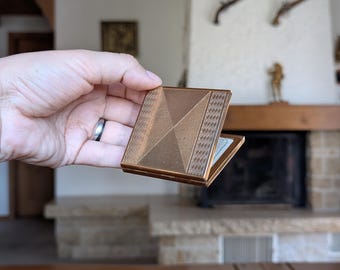 Vintage brass powder compact geometric design with mirror and puff