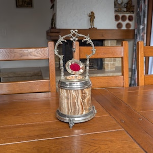 Reuge Swiss vintage musical cigarette dispenser with ornate metal frame and marble base for luxury smoker’s gift
