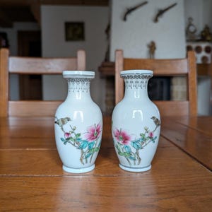 Pair of vintage porcelain Chinese vases from the 70s with red branding “Zhong Guo Jing de Zhen Zhi” hand painted bird on a flowering tree