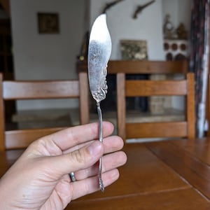 Wm Rogers & Son vintage butter knife with floral design silverplate collectible cutlery piece for elegant table setting