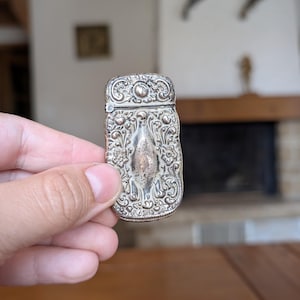 Antique Art Nouveau floral sterling silver 925 match safe case with ornate repousse design from early 1900s