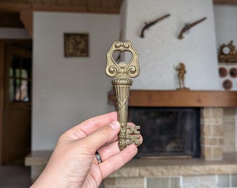 Vintage brass key-shaped bottle opener as a gift for beer lover and rustic bar decor