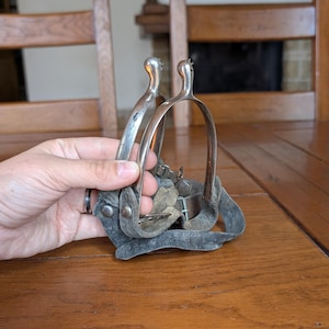 Vintage riding spurs pair from the early 20th century for equestrian decor collecting enthusiasts