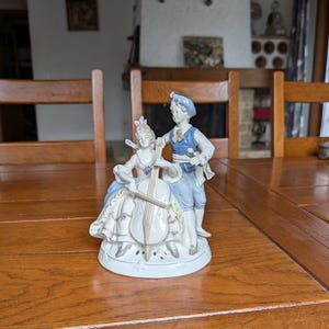 DDR 1877 Lippelsdorf porcelain large statue of a loving couple girl with cello and man with flower mid-century decor from Germany
